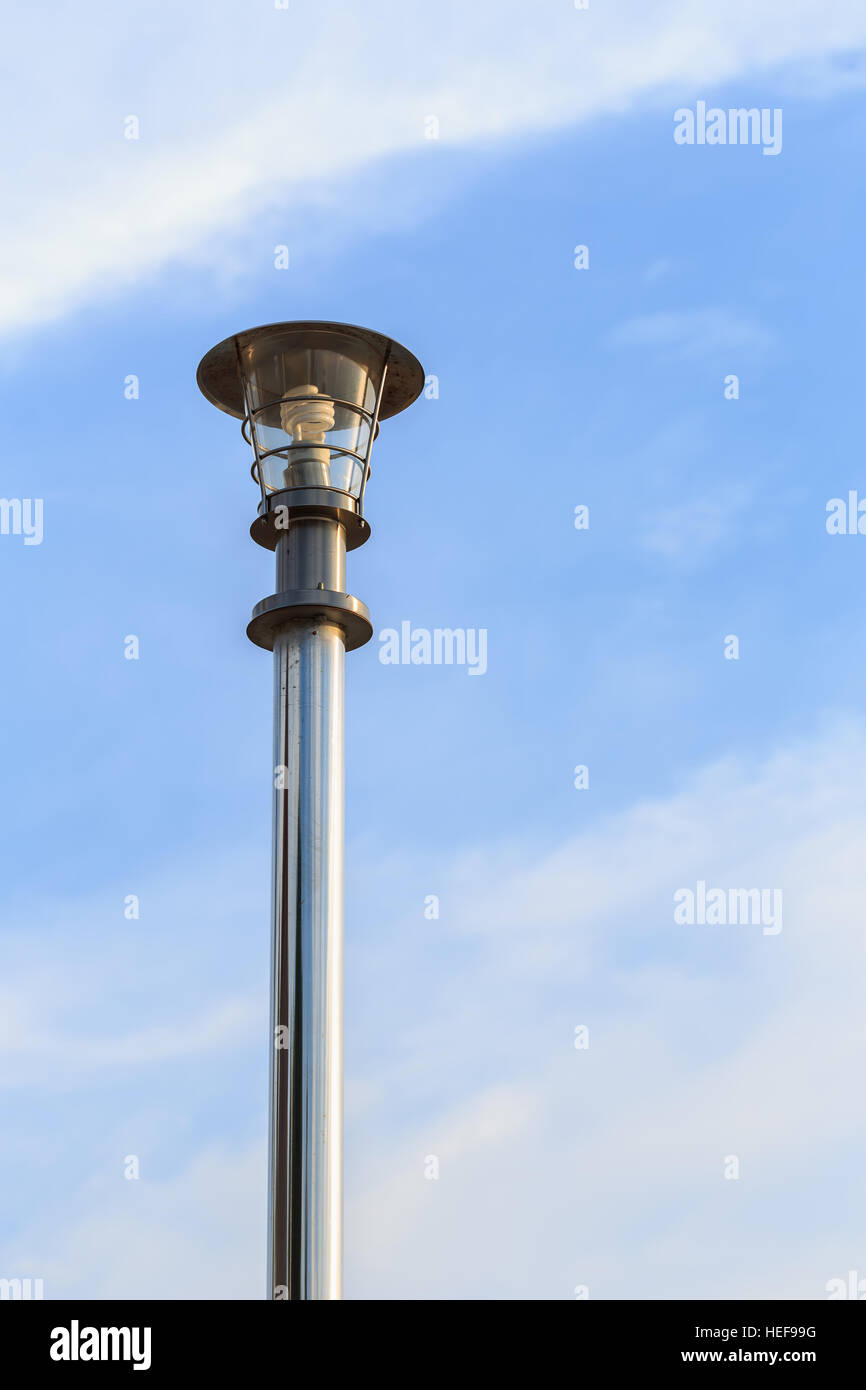 https://c8.alamy.com/comp/HEF99G/stainless-steel-lamp-pole-at-the-road-on-blue-sky-background-HEF99G.jpg