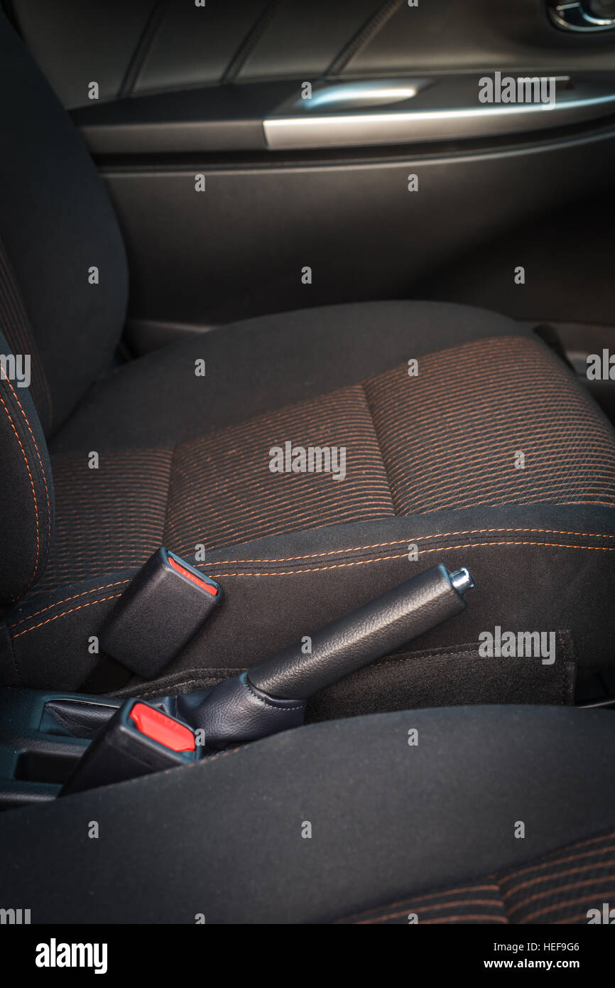Detail of new modern car interior, Focus on hand seatbelt Stock Photo