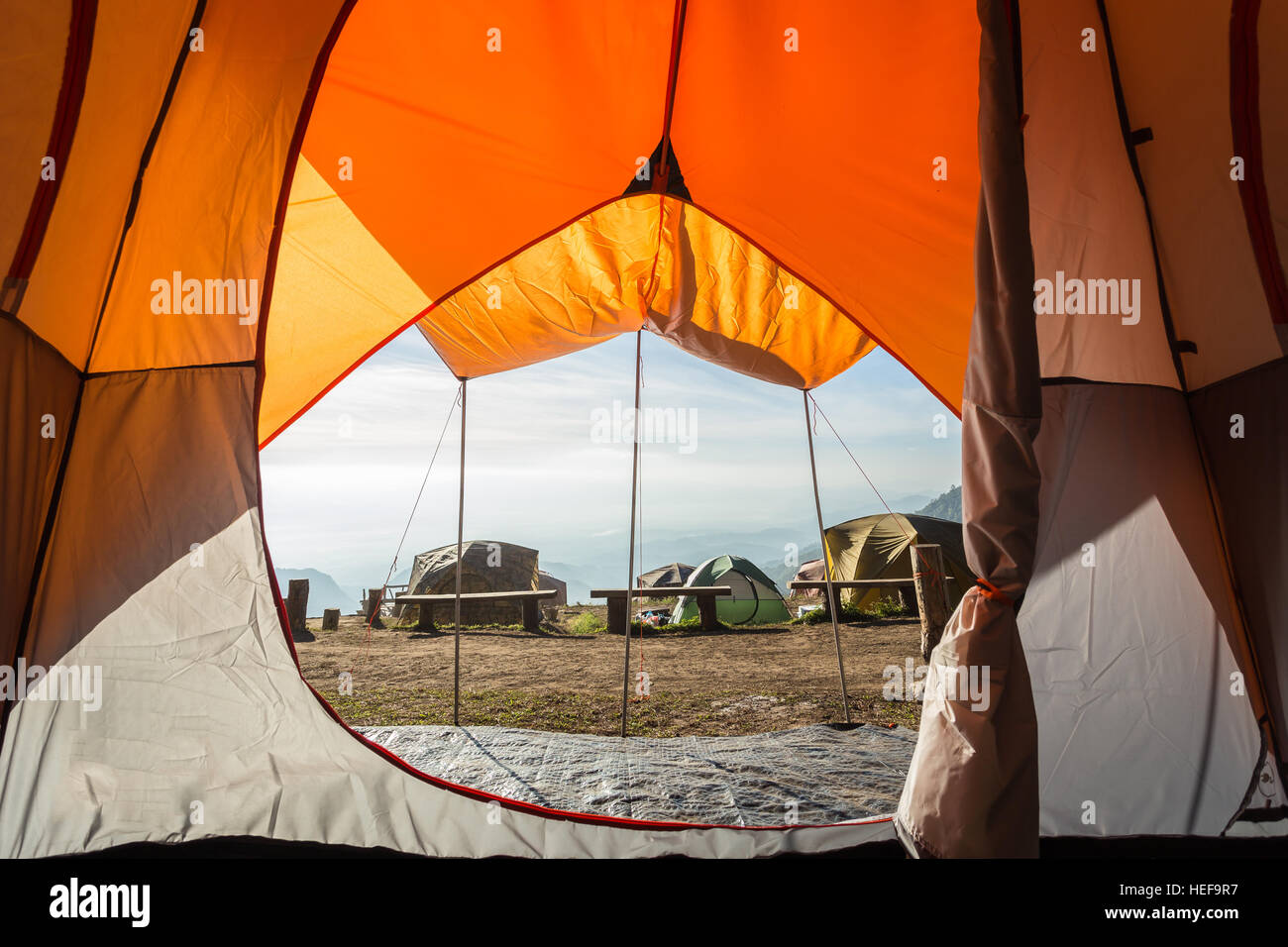 Orange camping tent on the mountain, view from inside Stock Photo - Alamy