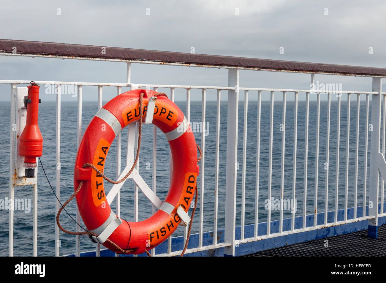 Lifebuoy on Stena Line Europe ferry deck and open sea view Stock Photo