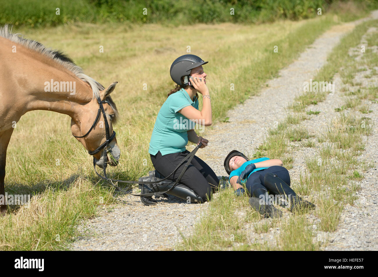 Riding accident, injured girl Stock Photo Alamy