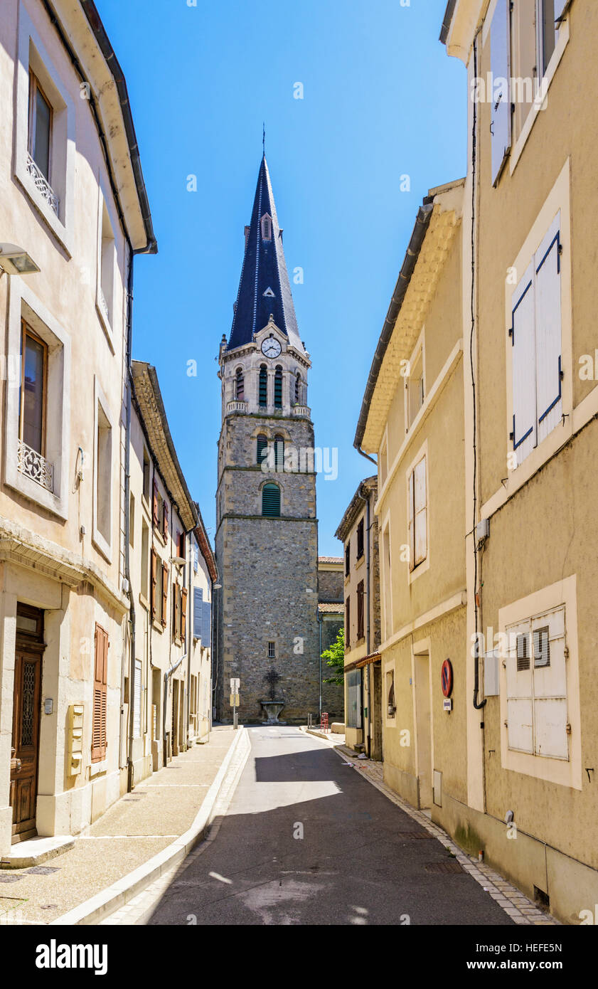 Quiet street and clock tower of the Church of Notre Dame de Tain, Tain-l'Hermitage, Drôme, Auvergne-Rhône-Alpes, France Stock Photo