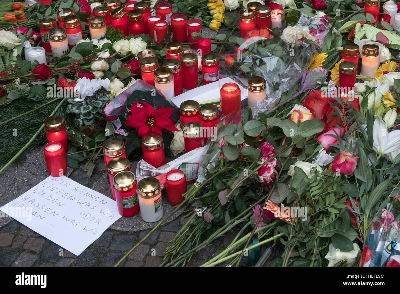 Candles and flowers at the  Christmas Market in Berlin, the day after the terrorist attack. Stock Photo