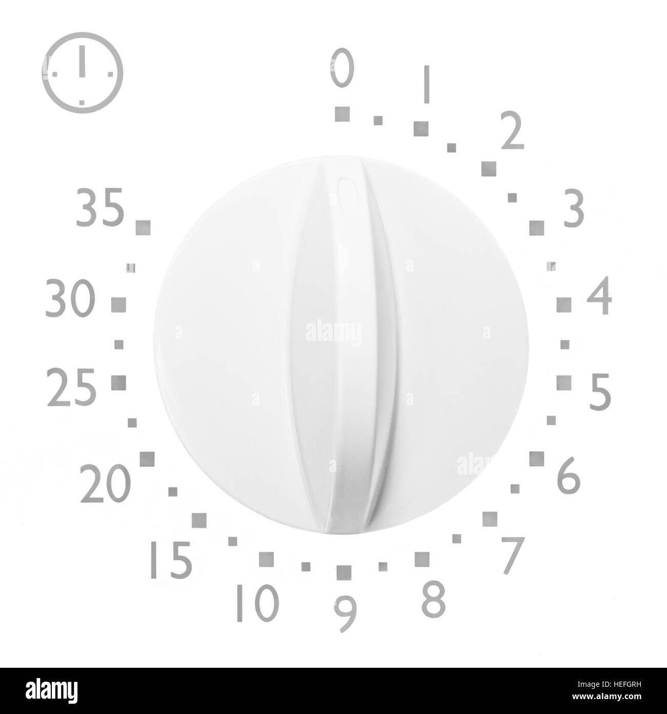 Analog 35 minute microwave oven timer, isolated analogue vintage white dial face macro closeup gry numbers and icon, large background copy space Stock Photo