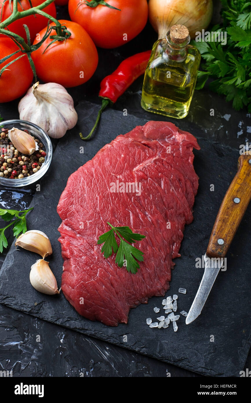 Raw fresh beef steak and vegetable. Selective focus Stock Photo