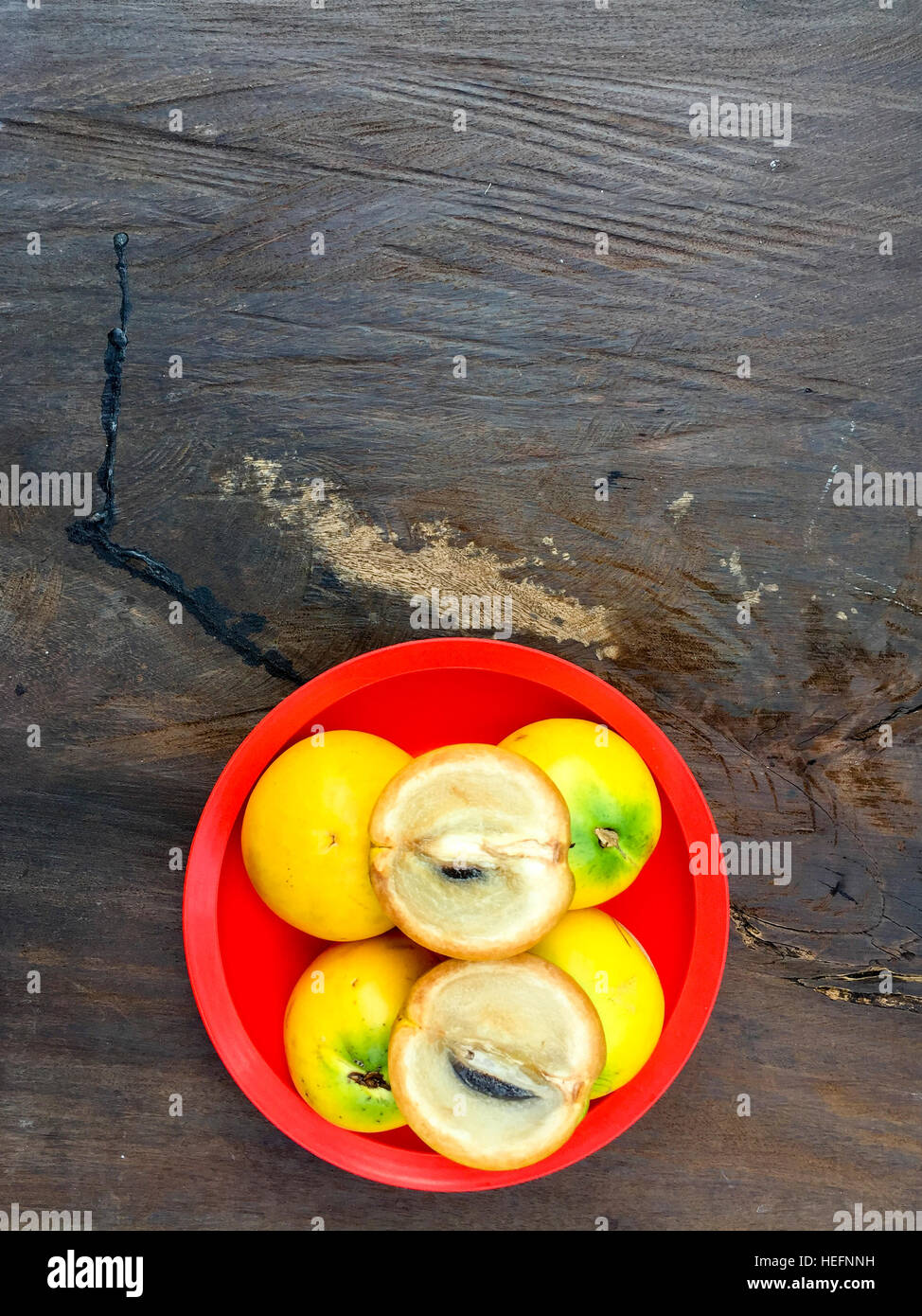 Fresh Abiu fruits on the top of wooden table. Stock Photo