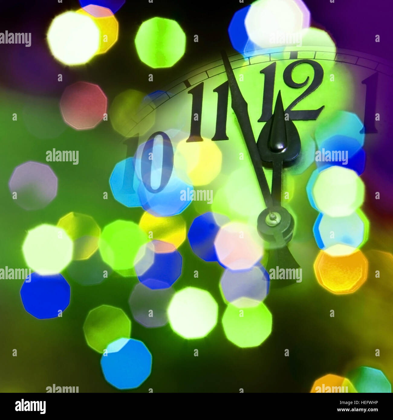 face of new year clock with colored light Stock Photo Alamy