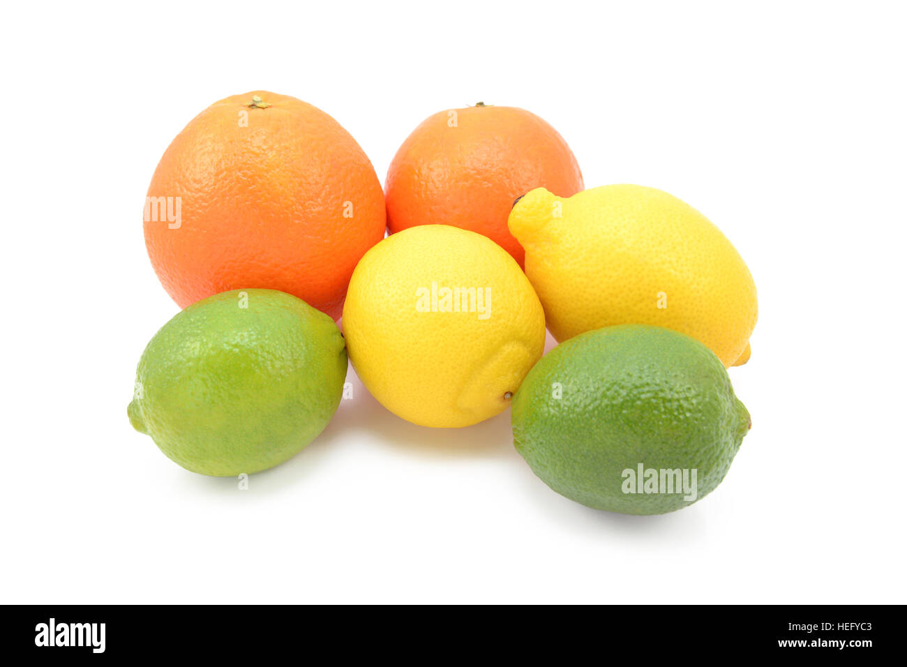 Six citrus fruits - limes, lemons and oranges - isolated on a white background Stock Photo