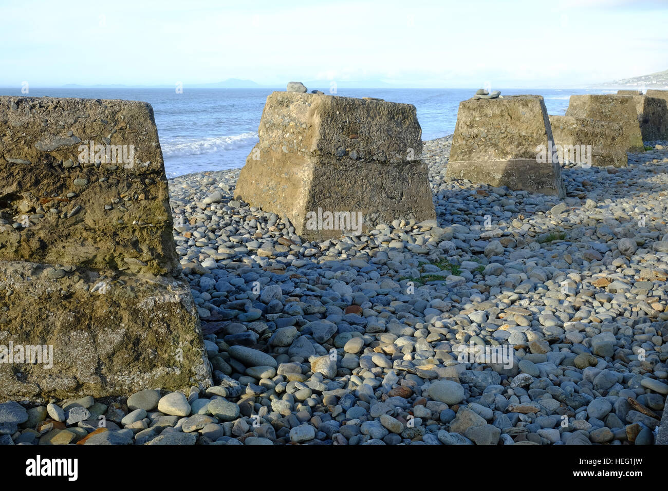 World War Two tank traps on the beach at Fairbourne on the west coast of Wales Stock Photo