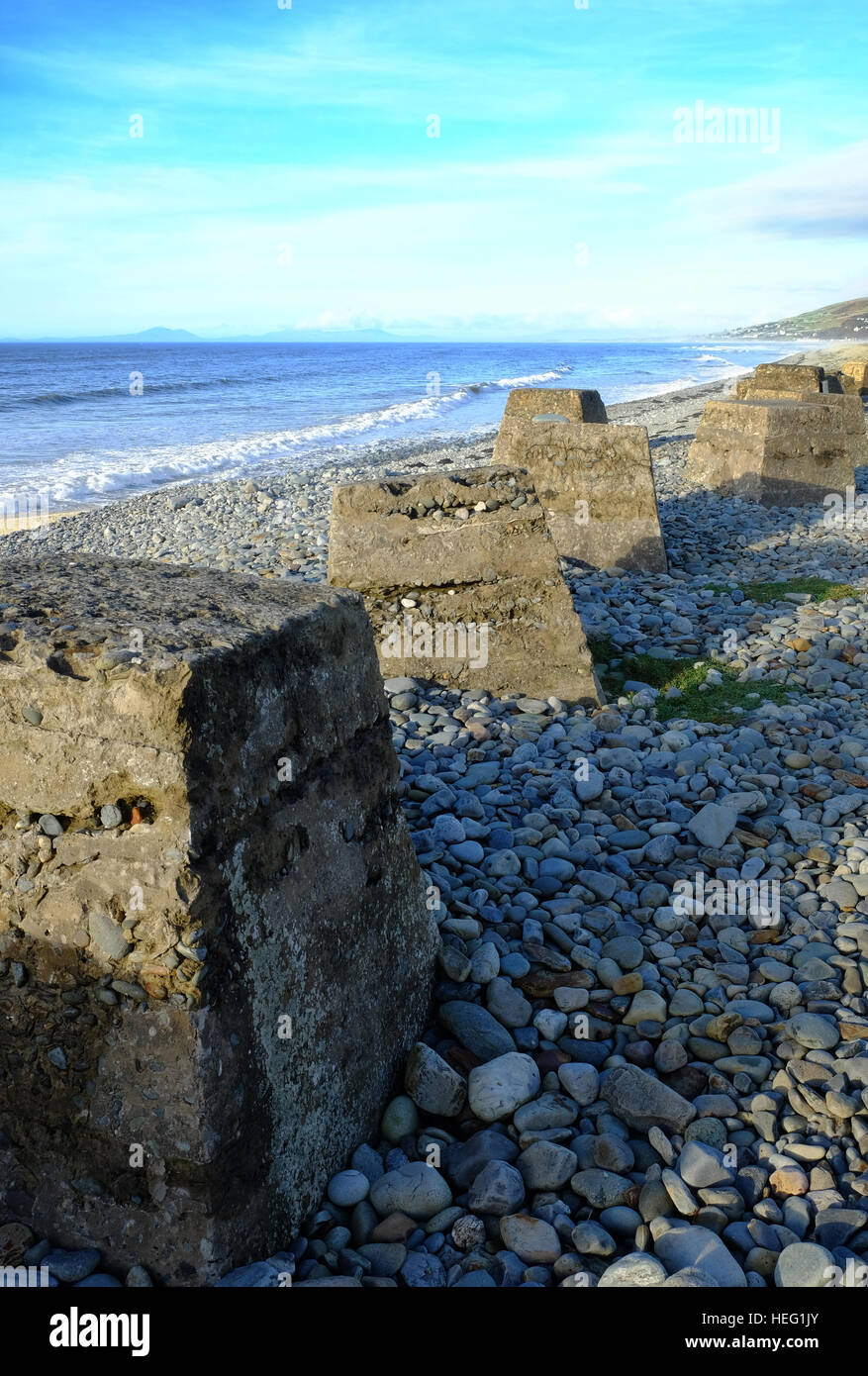 World War Two tank traps on the beach at Fairbourne on the west coast of Wales Stock Photo