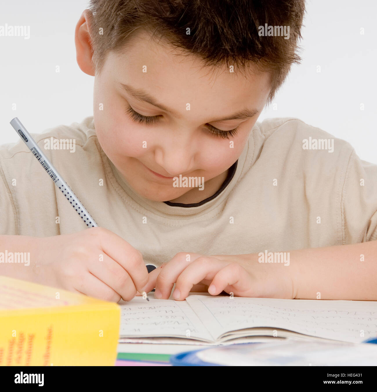 Schoolboy, seven-year-old boy doing his homework Stock Photo