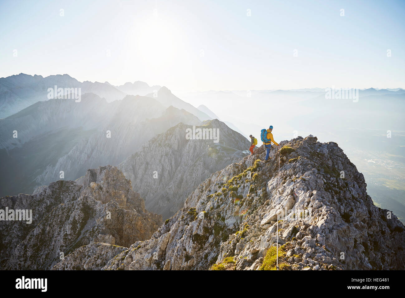 Mountain climbing, two climbers secured to steel cable, Inn Valley, Inntal Chain, Tyrol, Austria Stock Photo