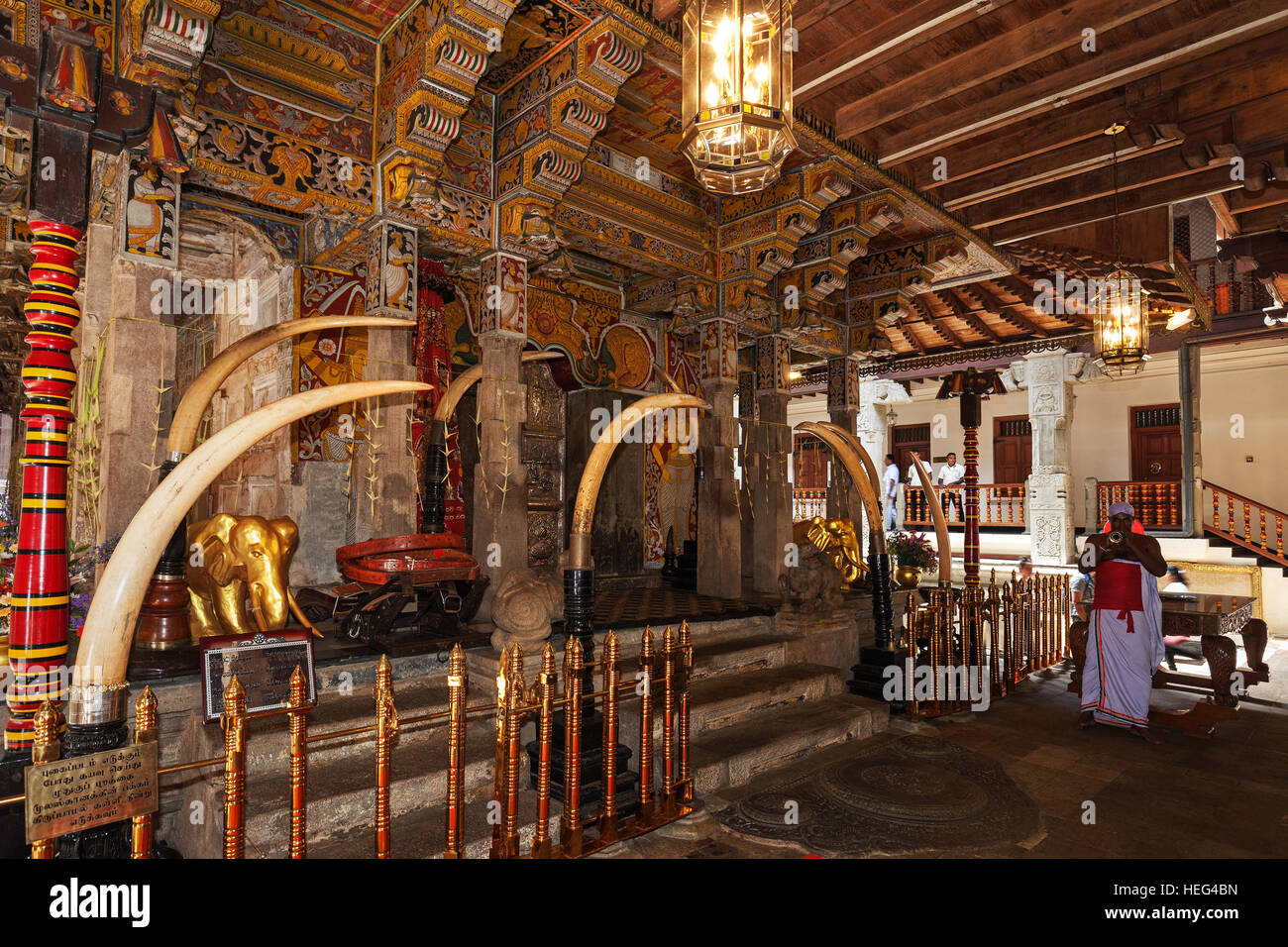 Flute player in front of holy shrine in Sri Dalada Maligawa or Temple of the Sacred Tooth Relic, Buddhist sanctuary, Kandy Stock Photo