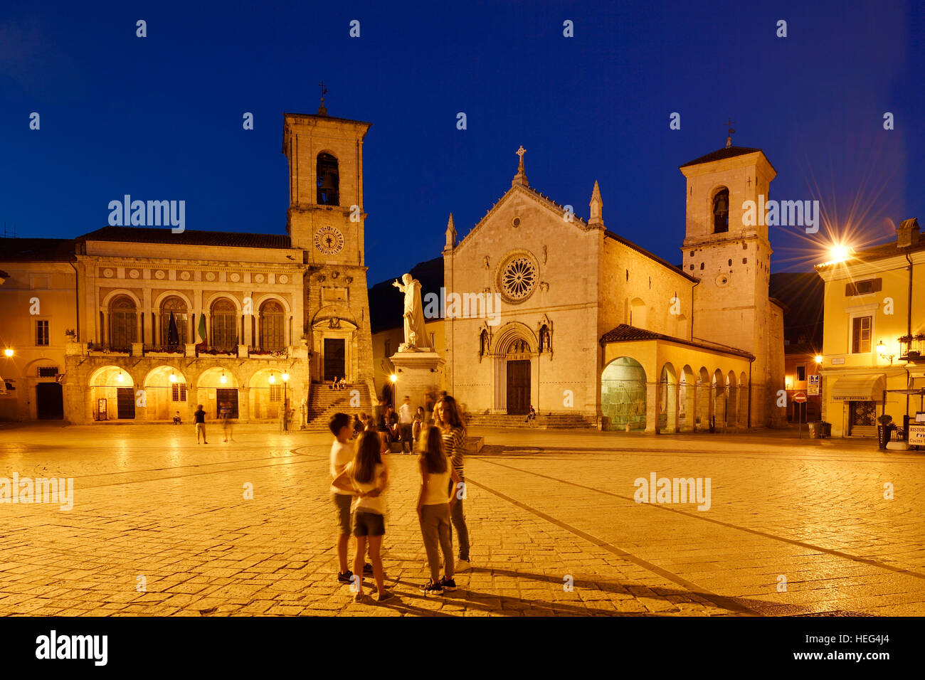 Palazzo Comunale and Basilica di San Benedetto, evening, Norica, Perugia, Umbria, Italy Stock Photo