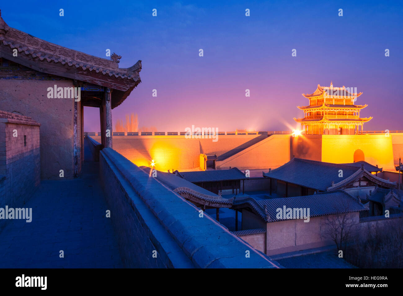Jiayuguan fort illuminated at twilight at the western boundary of the