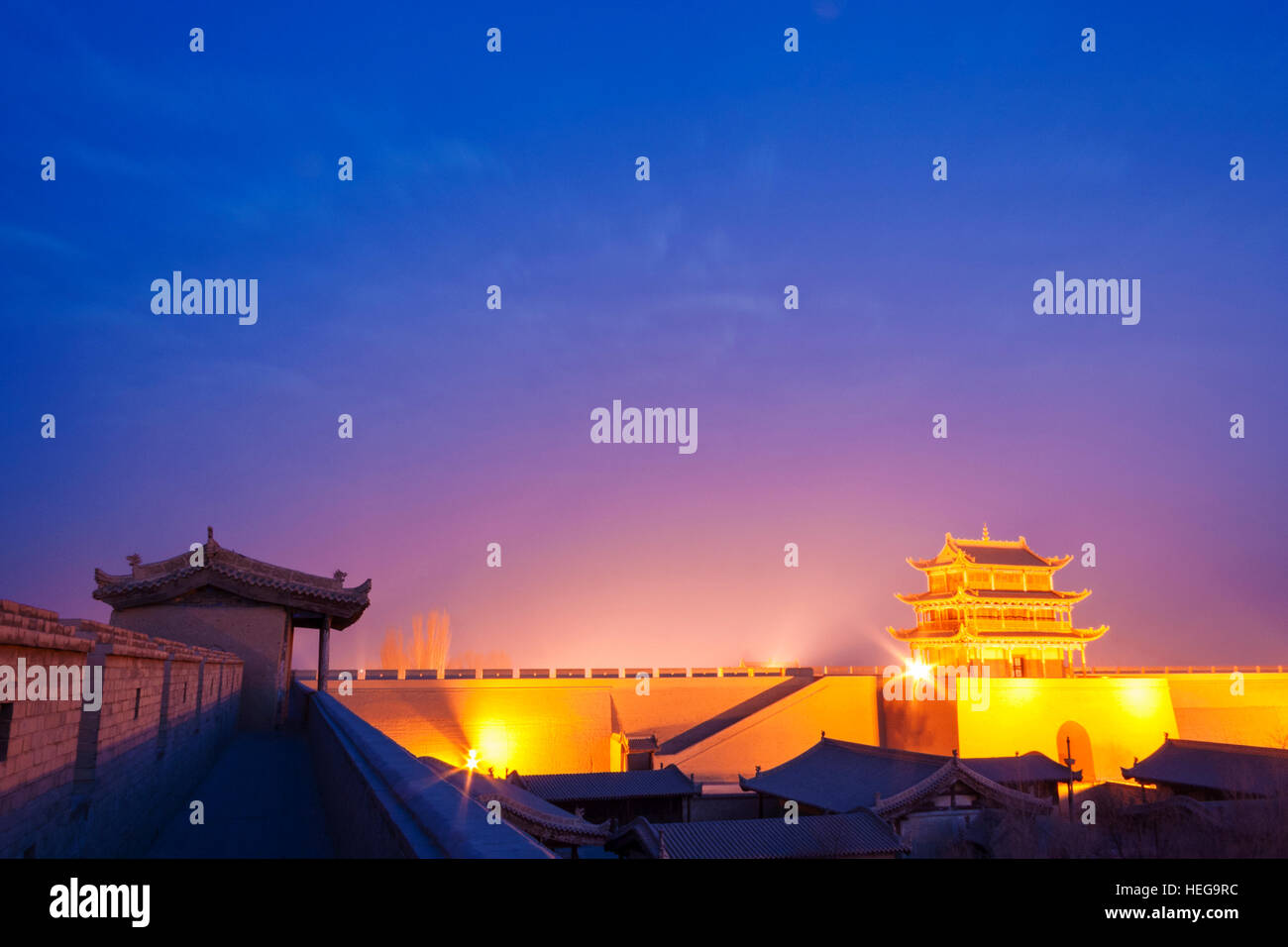 Jiayuguan fort illuminated at twilight at the western boundary of the