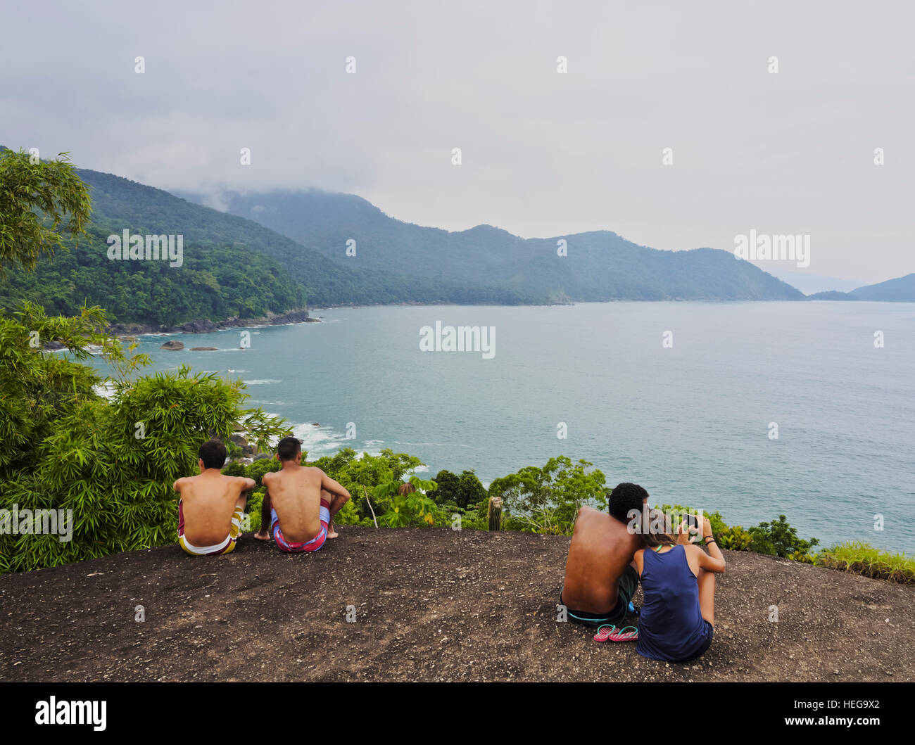 Brazil, State of Sao Paulo, Ilhabela Island, People looking at the coast from the Mirante do Gato. Stock Photo