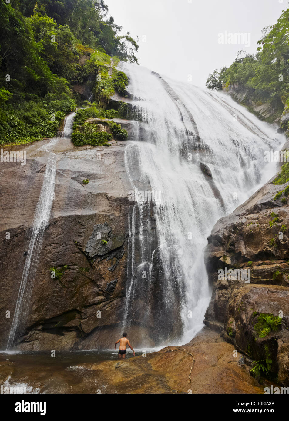 Brazil, State of Sao Paulo, Ilhabela Island, View of the Cachoeira do Gato Waterfall. Stock Photo