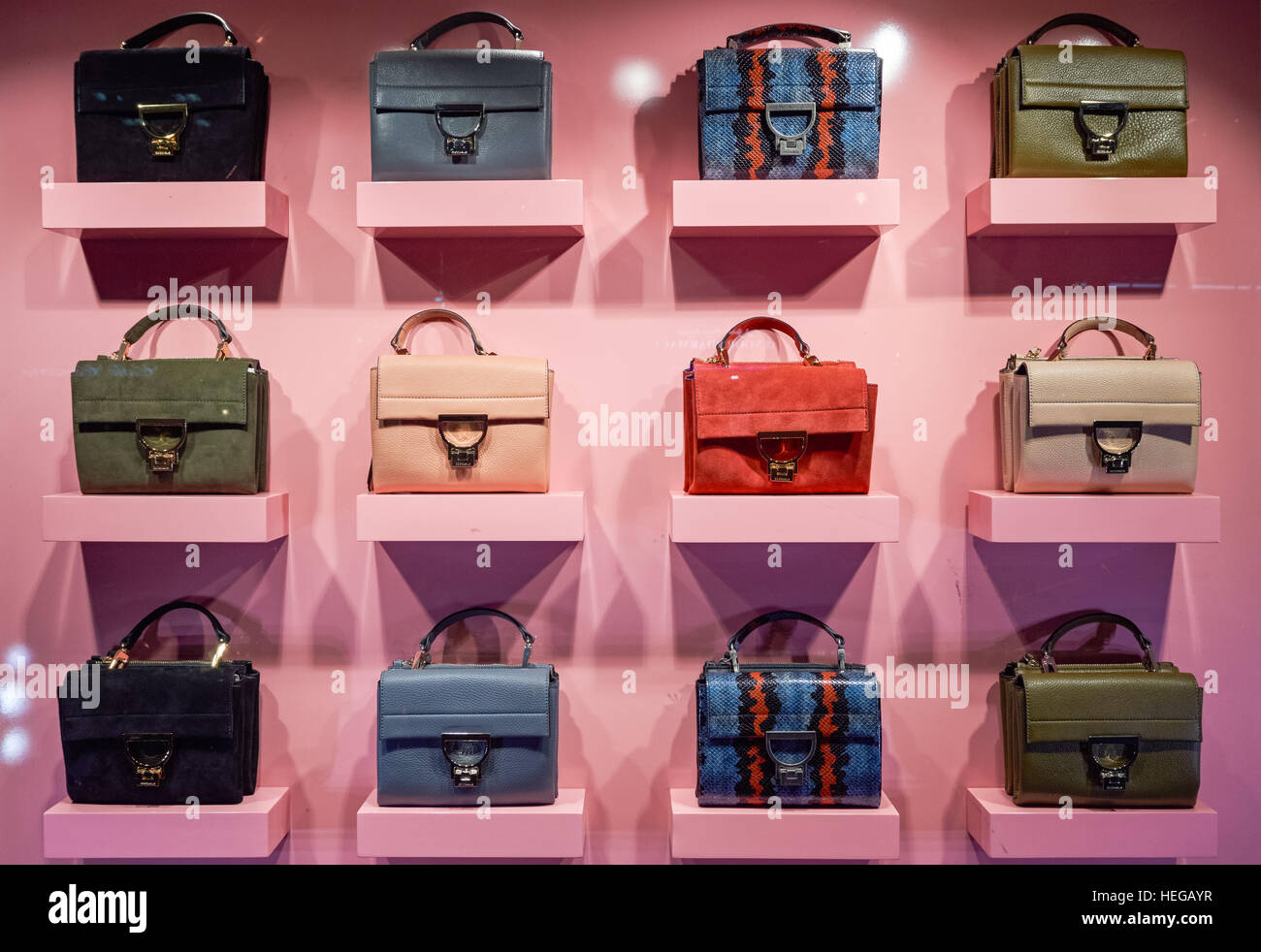 Bags on window display in Coccinelle shop at Brompton Road