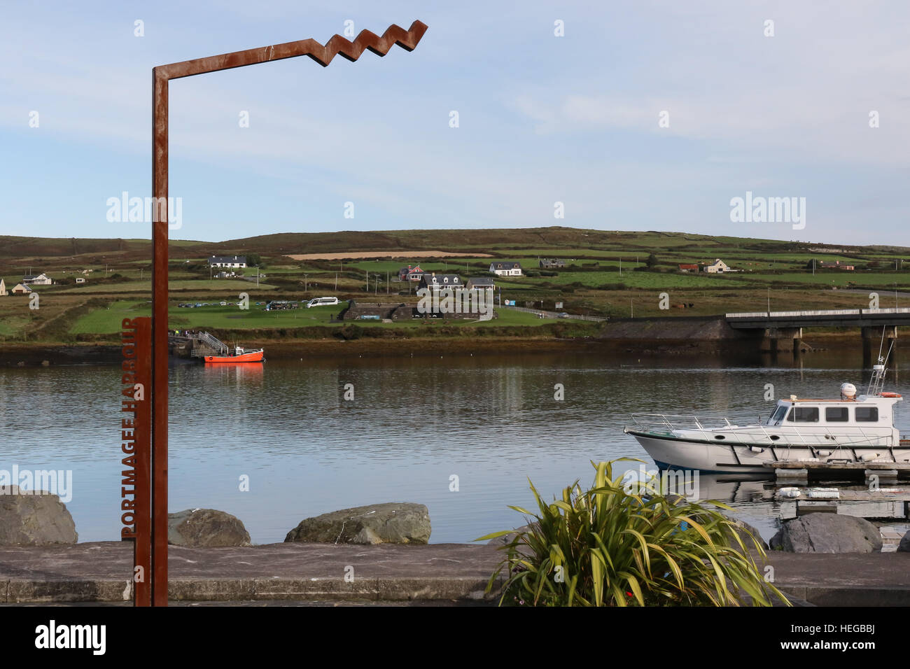 Wild Atlantic Way sign at Portmagee Harbour, with the road bridge to Valentia Island, County