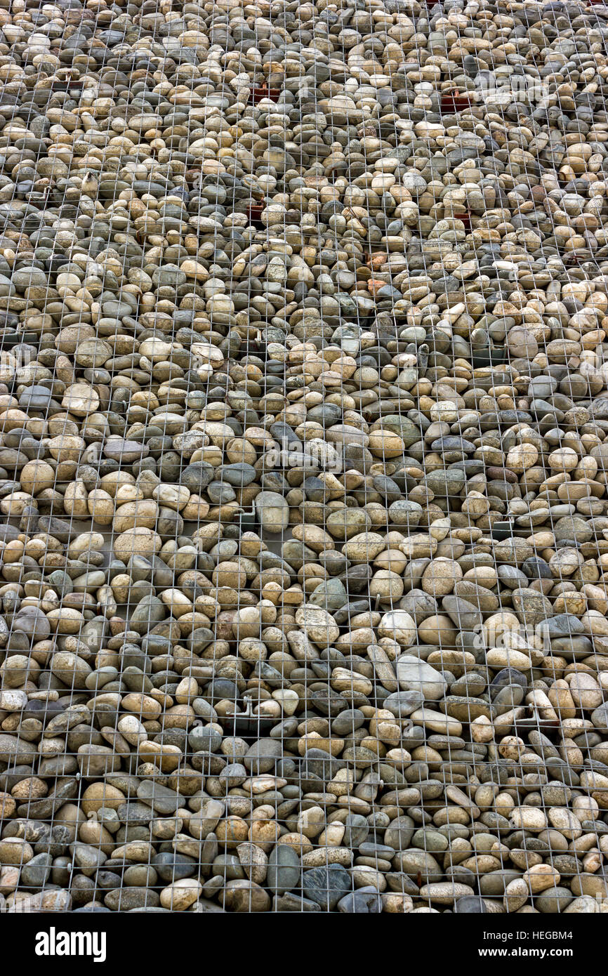 Backgrounds collection - The decorative stone wall built of sea pebbles Stock Photo