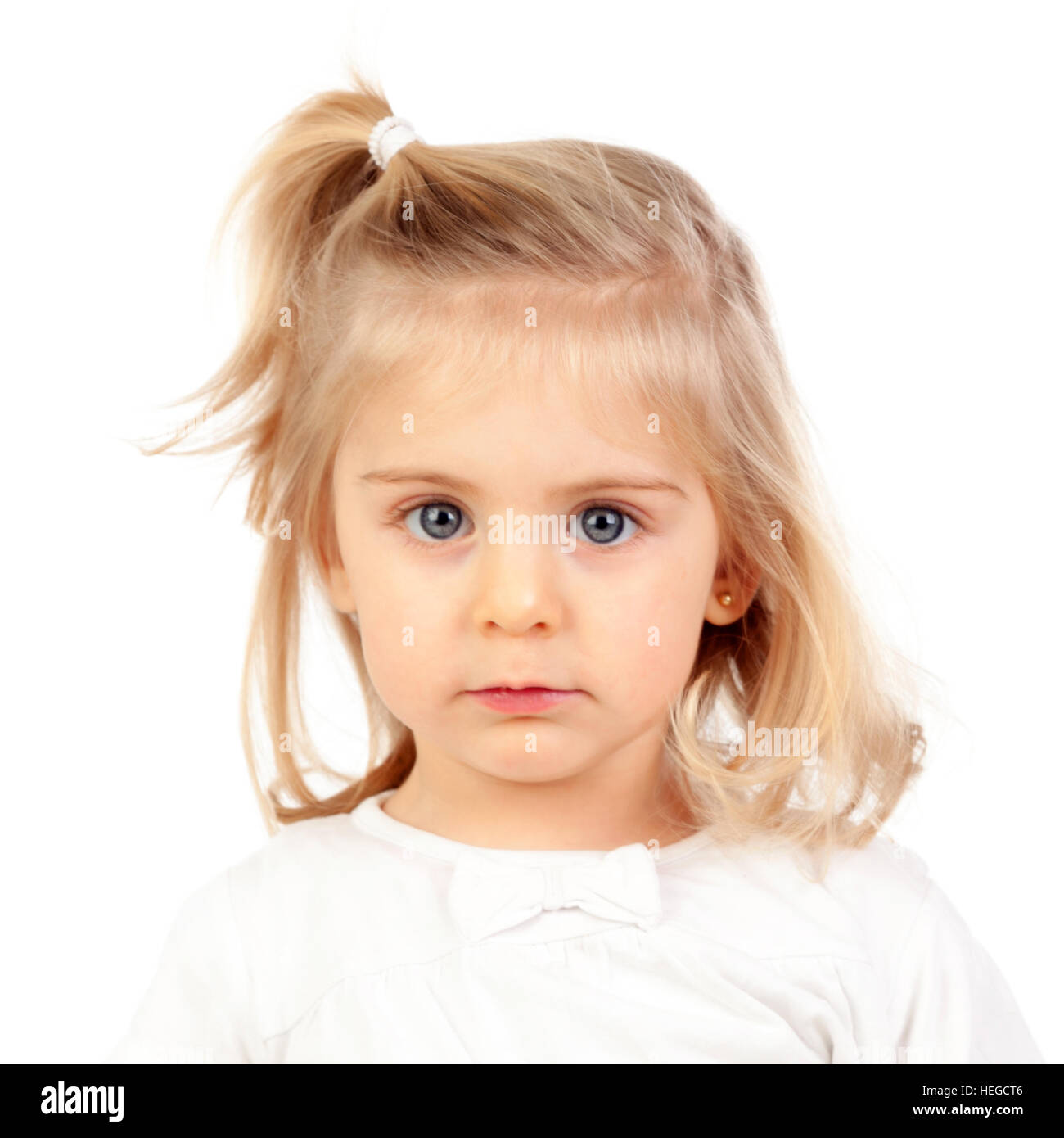 Blonde baby girl standing on patio holding broom Stock Photo - Alamy