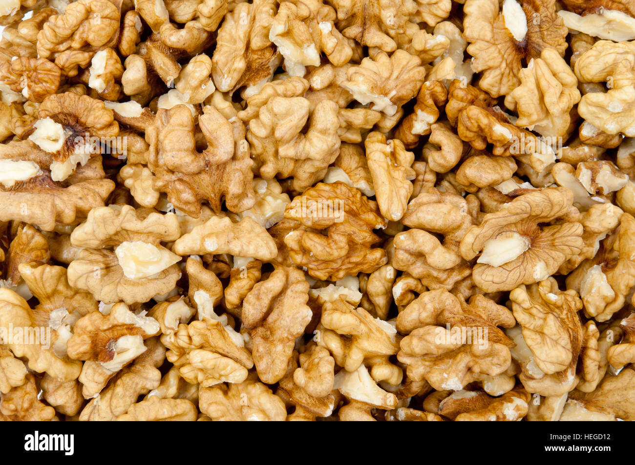 Shelled walnuts pile as background Stock Photo