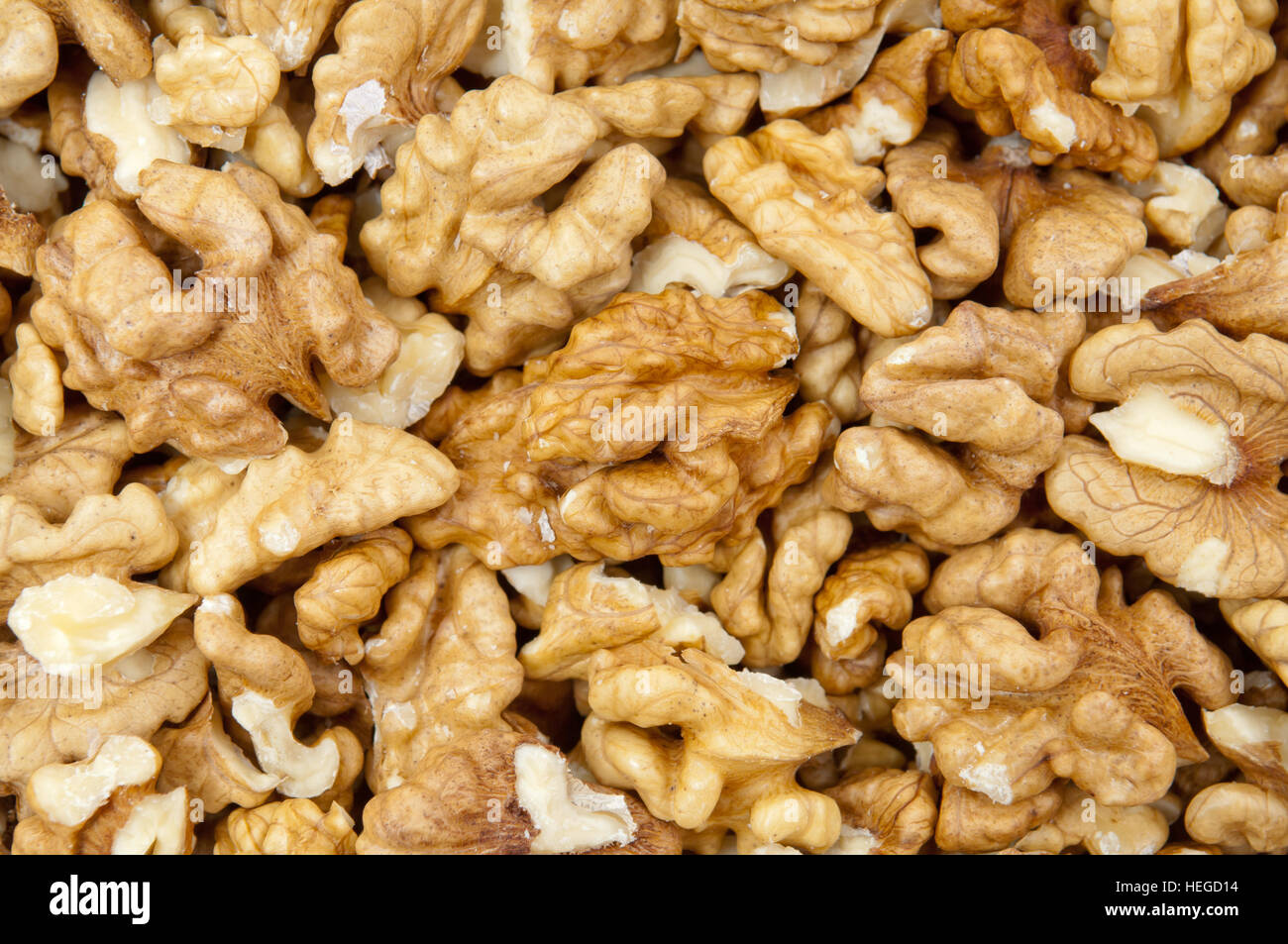 Shelled walnuts pile as background Stock Photo