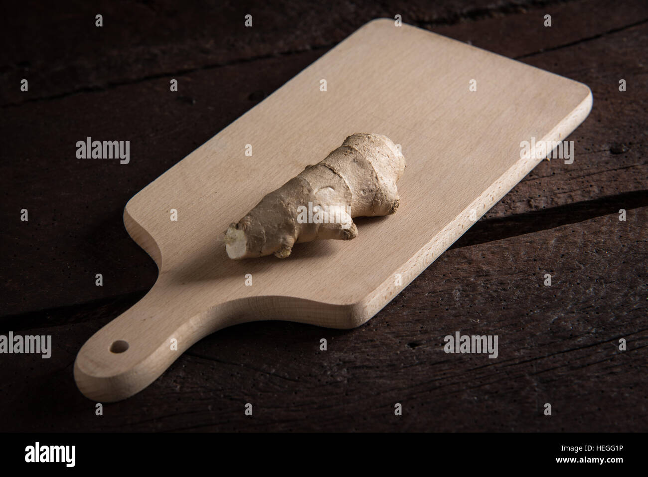 One piece of ginger root on the cutting board Stock Photo