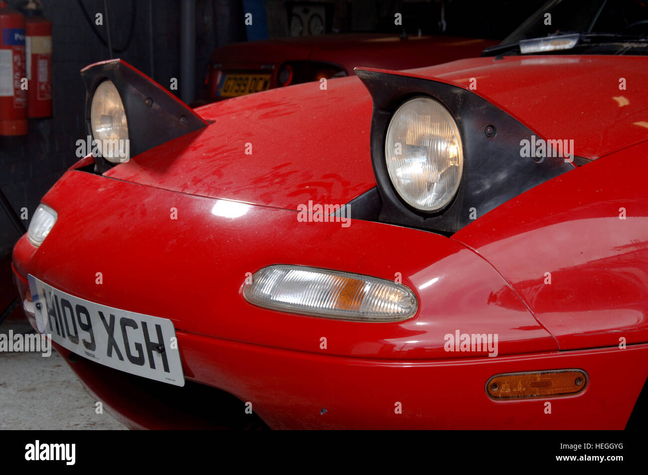 Pop up headlights a red Mazda MX5 sports car Stock Photo - Alamy