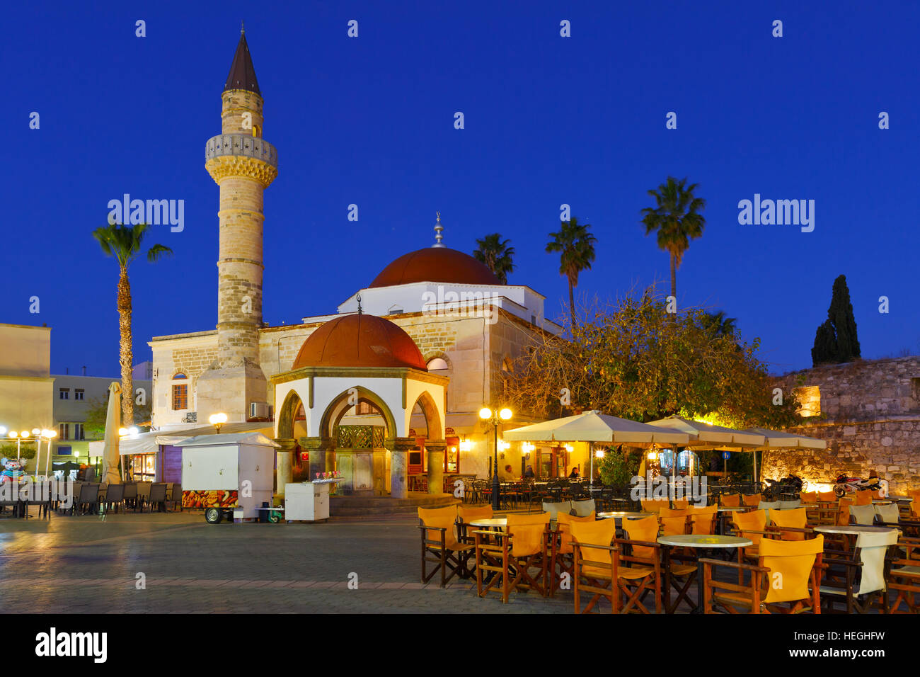 Mosque and coffee shops in the main square of the Kos town Stock Photo