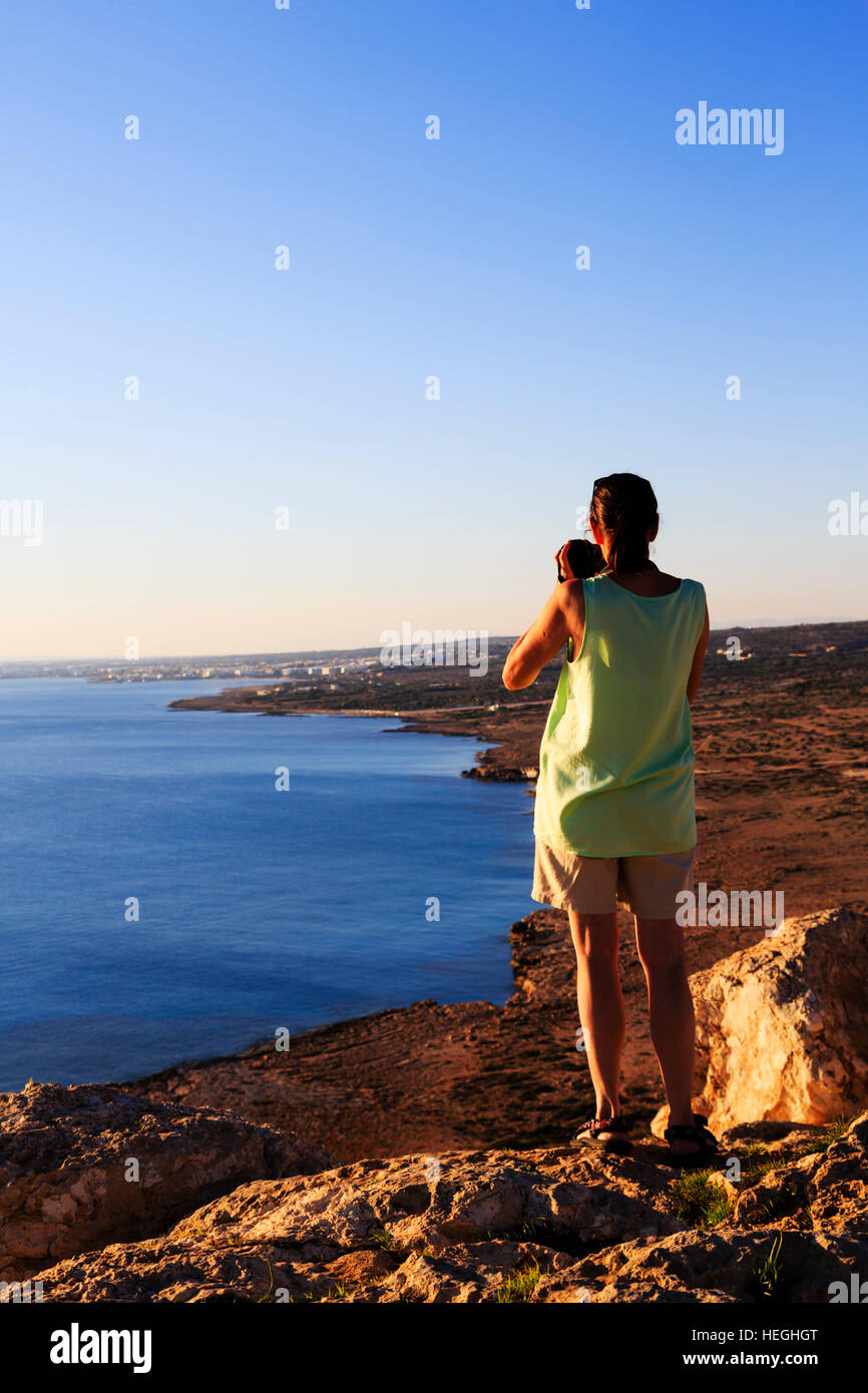 Female standing cliff top hi-res stock photography and images - Alamy