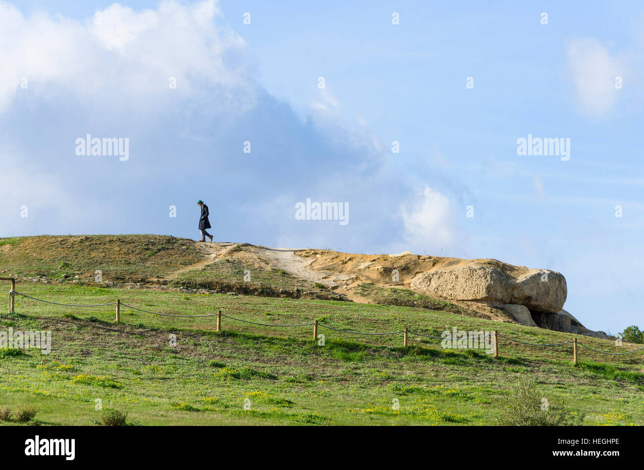 Man walks over La Menga Dolmen, dolmens, prehistoric burial chambers, megalithic tombs, Antequera, Andalusia, Spain Stock Photo