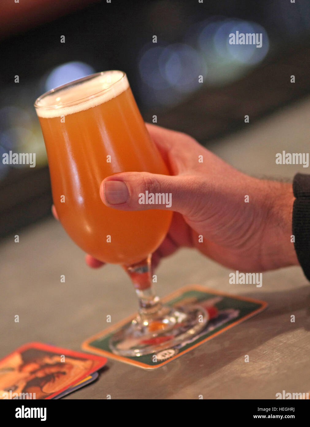 Hand holding a craft beer Stock Photo