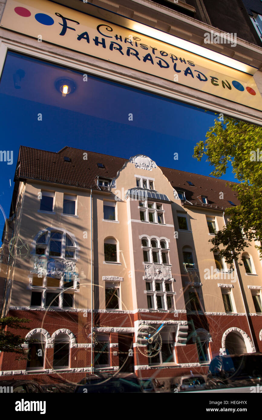 Germany, old apartment houses in the street Neuer Graben at the district Kreuzviertel mirroring in a window of a bicycle shop. Stock Photo