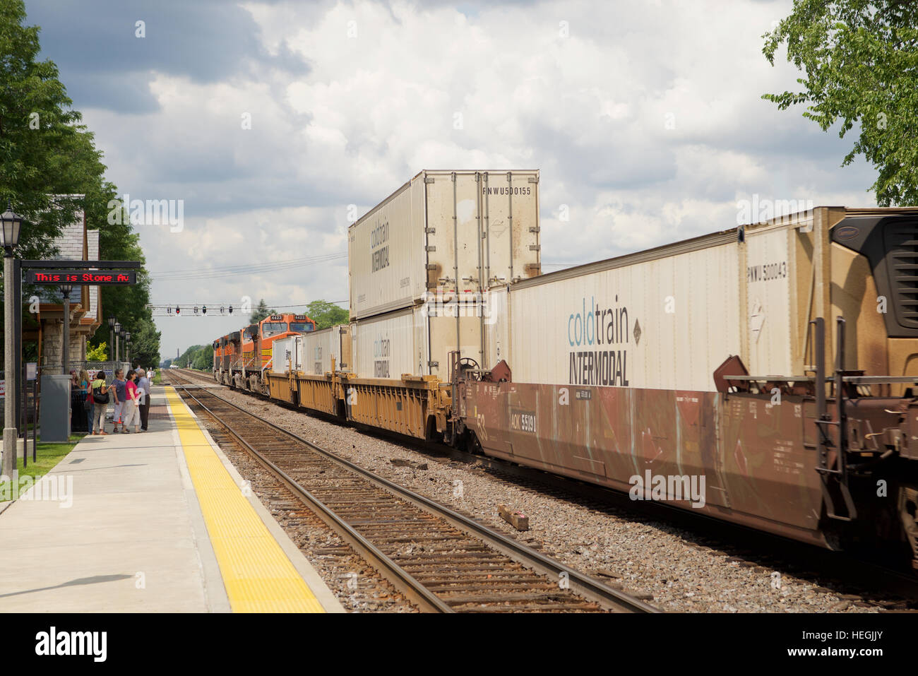 BNSF powered double-stack container train at Stone Avenue Train Station, La Grange, Illinois, USA. Stock Photo