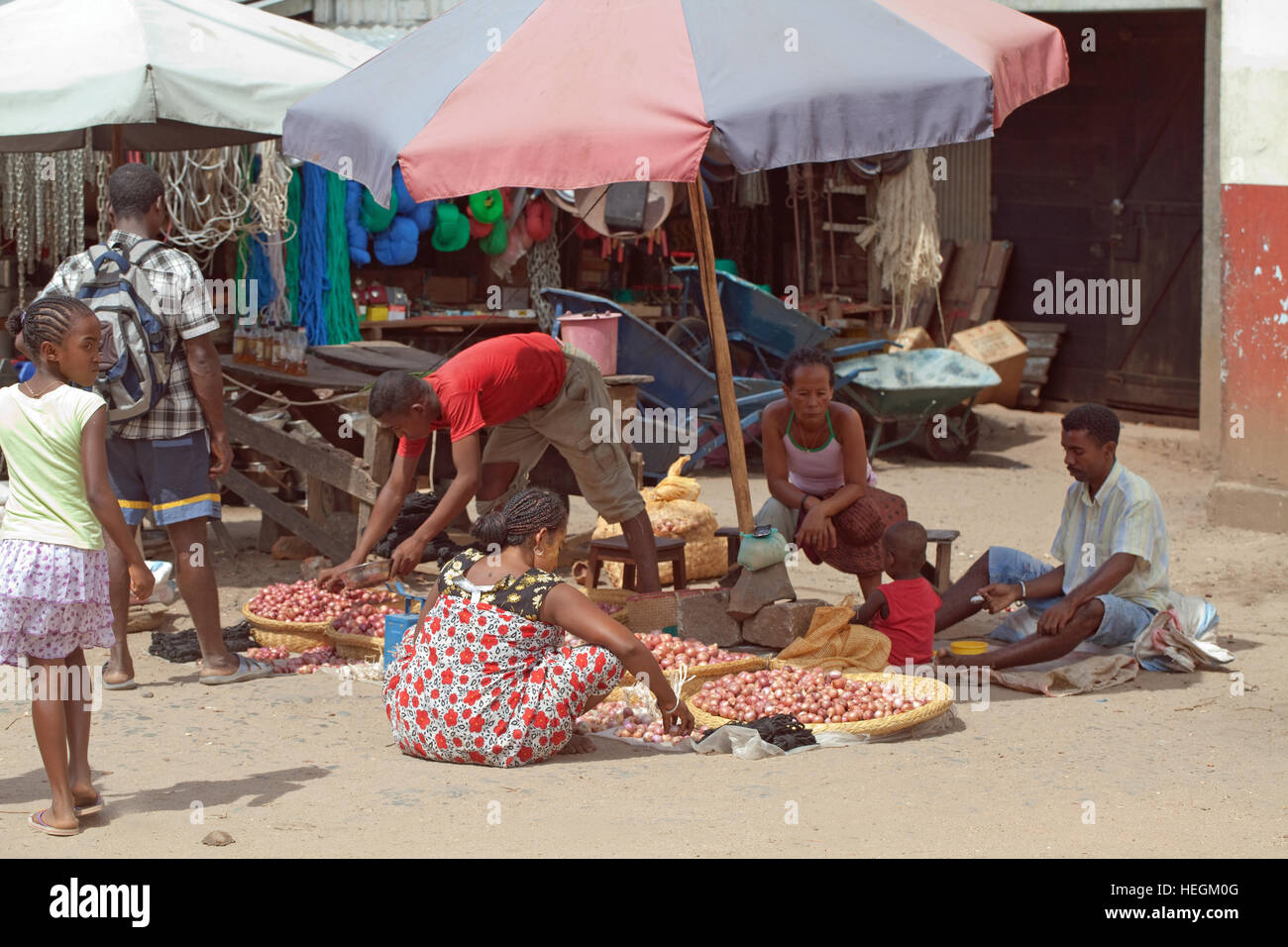 Selling onions. Roadside Market Stall. Sambava. Madagascar. Stock Photo