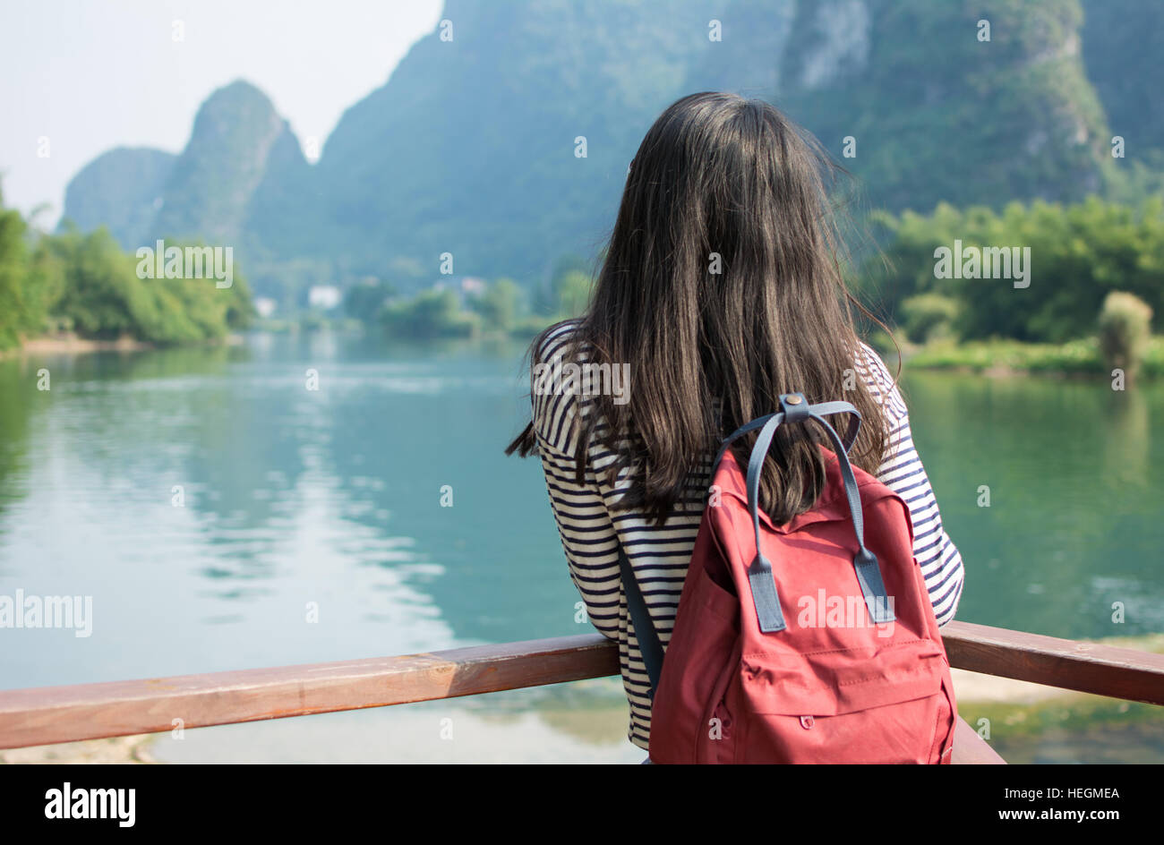 Girl admiring the karst scenic area on a hiking trip Stock Photo