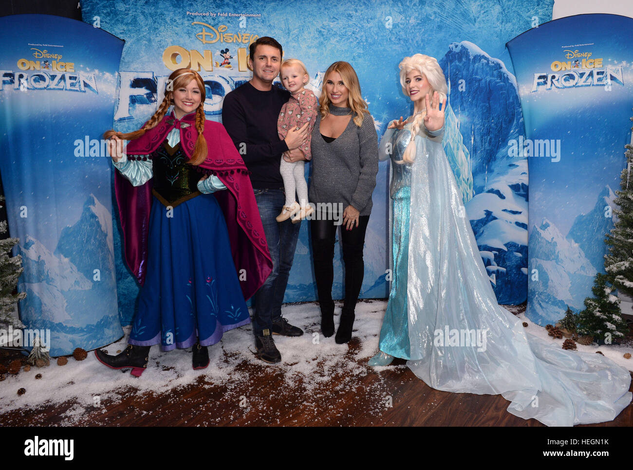 Billie Faiers with fiancee Greg Shepherd and daughter Nelly meet Anna and Elsa at The O2, London for the opening night of Disney On Ice presents Frozen. Stock Photo