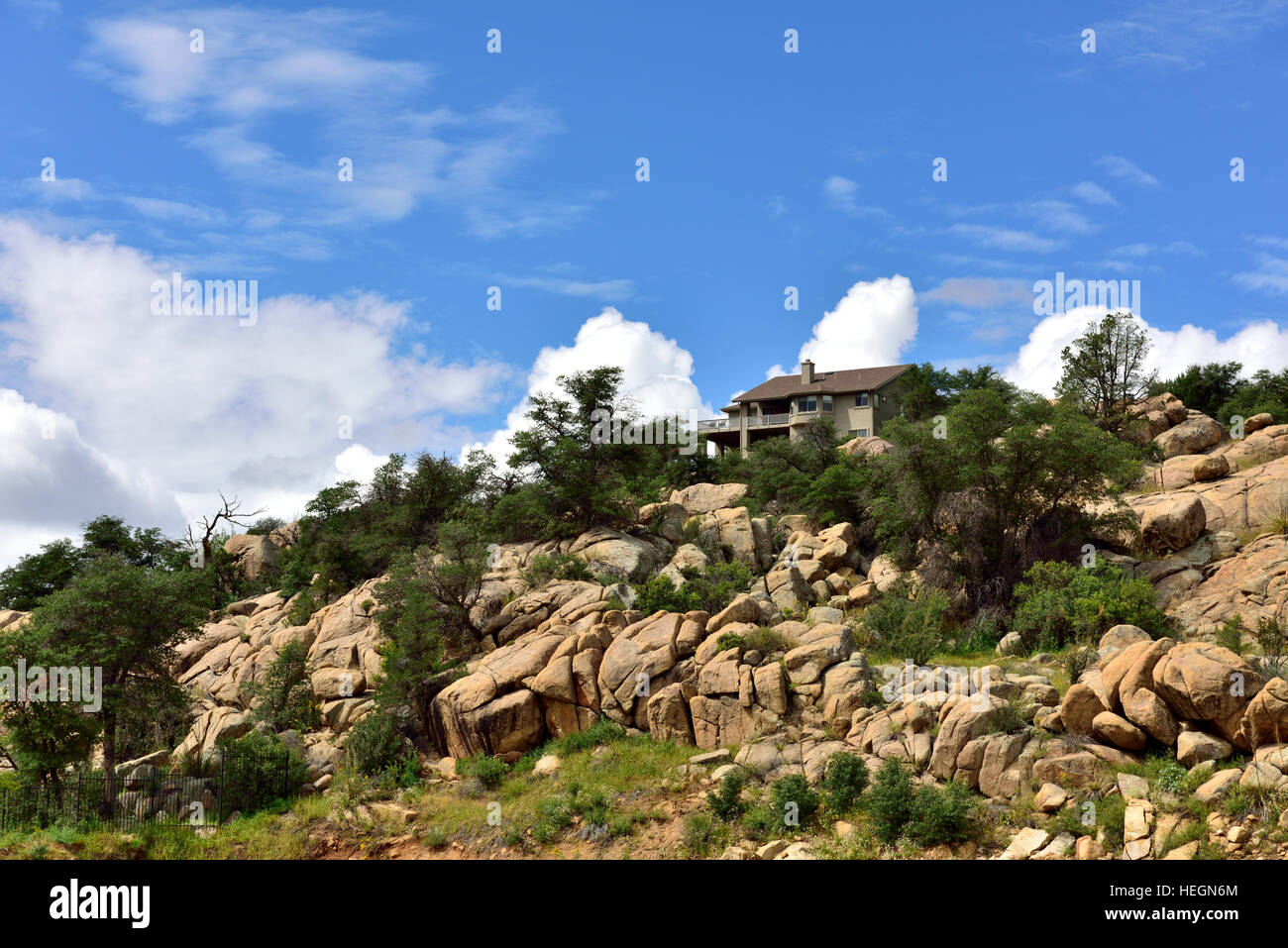 House above granite boulders suburbs, Prescott, Arizona, USA Stock Photo