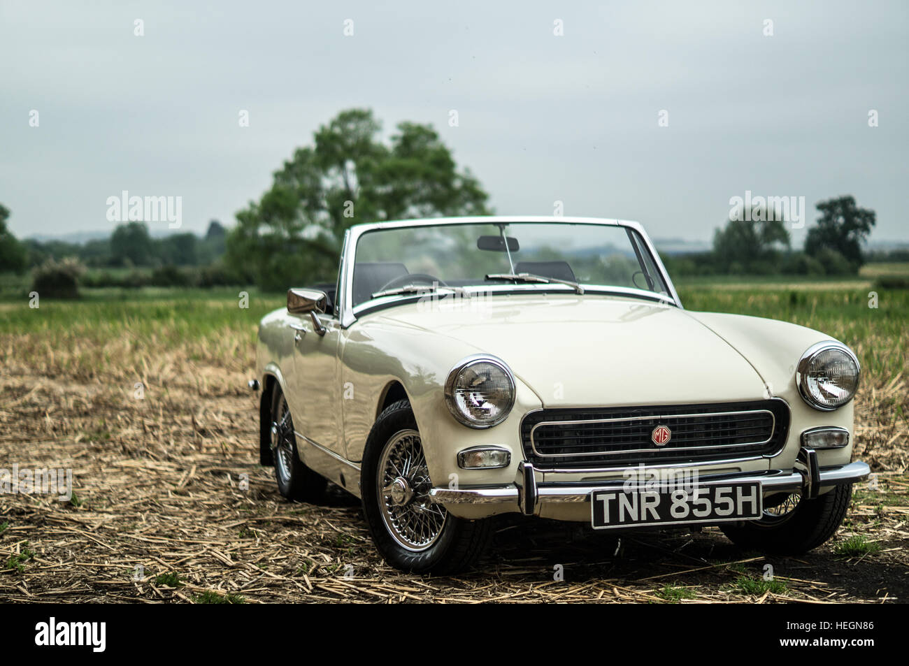 Cream MG Midget parked in the countryside. Stock Photo