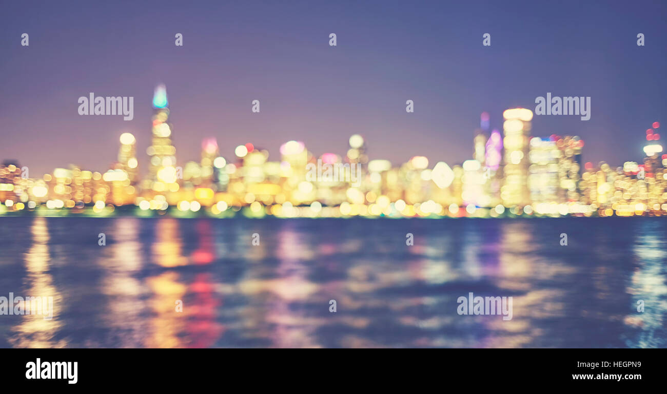 Vintage toned blurred city lights, urban abstract background. Stock Photo