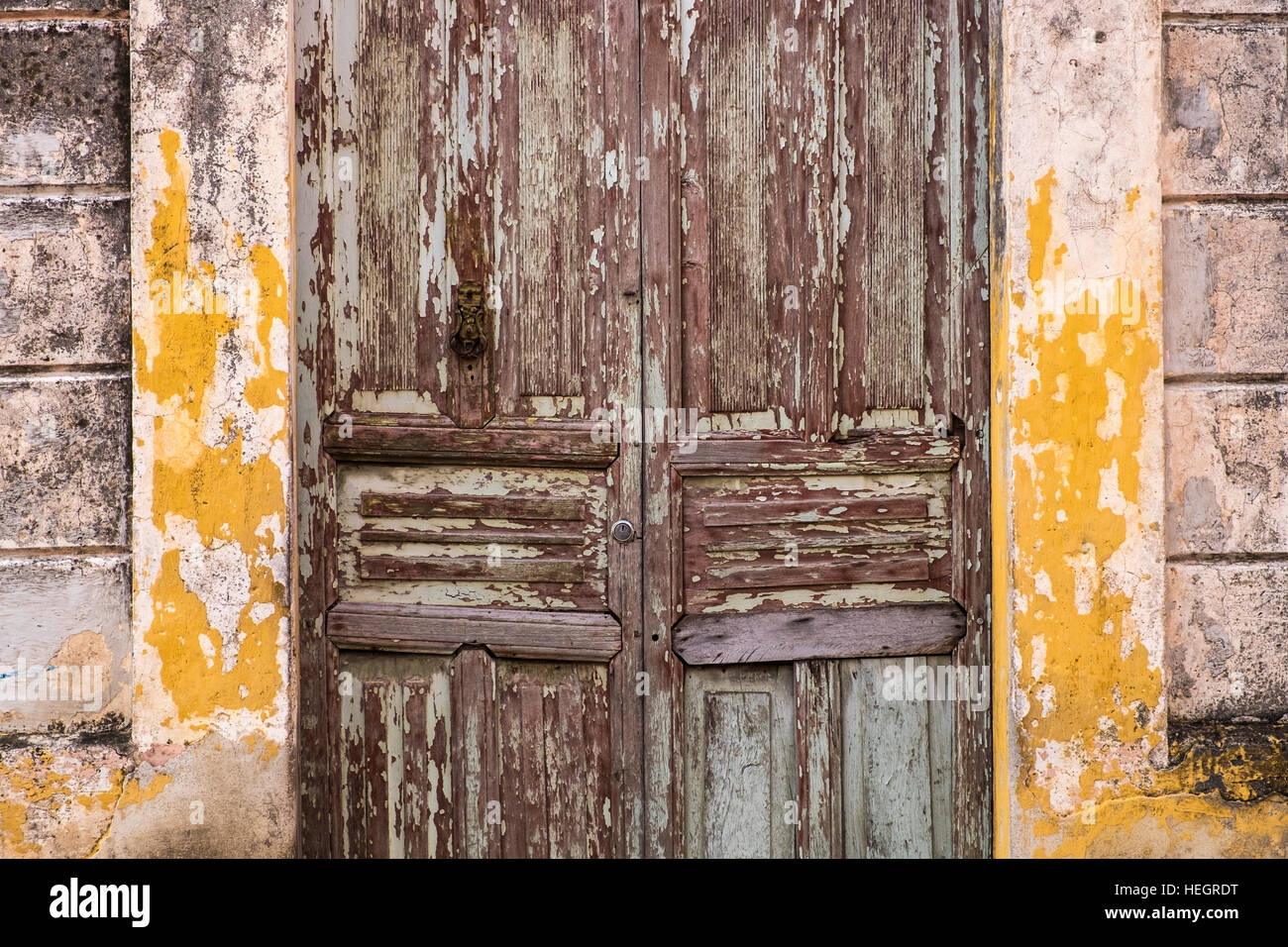 Old door with peeling paintwork, Camaguey, Cuba Stock Photo