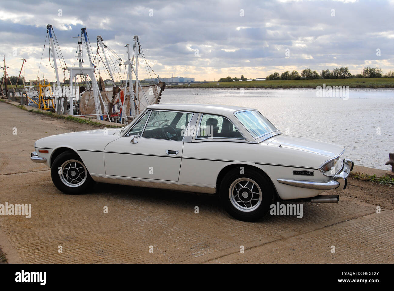 White Triumph Stag hardtop on the quayside Stock Photo