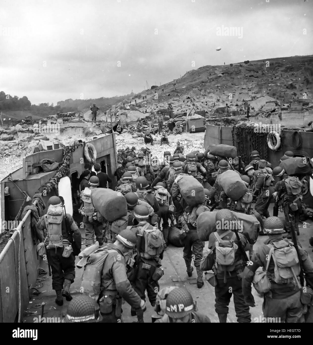 NORMANDY LANDINGS 1944  American Military Police detachment go ashore in France a few days after the initial landings on 6 June Stock Photo