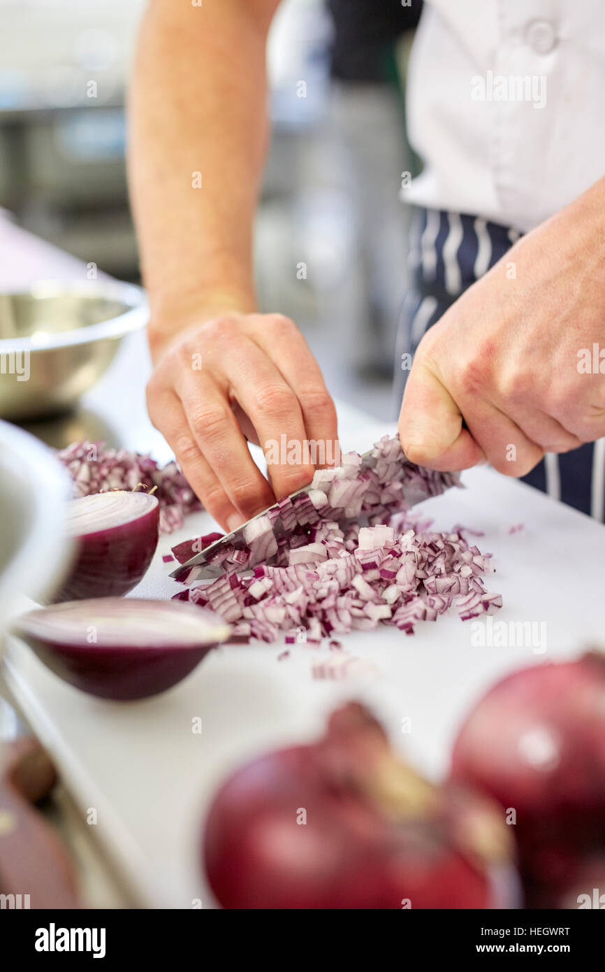 Chef chopping onions restaurant mis en place fingers knives knife blade sharp clean hygienic
