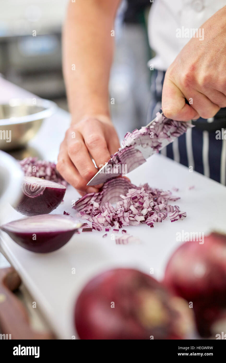 Chef chopping onions restaurant mis en place fingers knives knife blade sharp clean hygienic