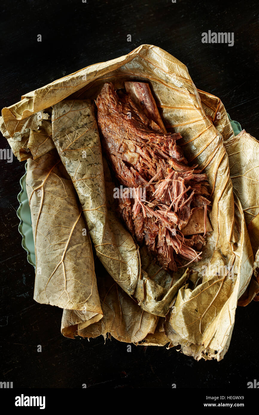 Chinese slow cooked rib of beef wrapped in lotus leaf northern chinese dish  Hutong Shard restaurant Stock Photo - Alamy