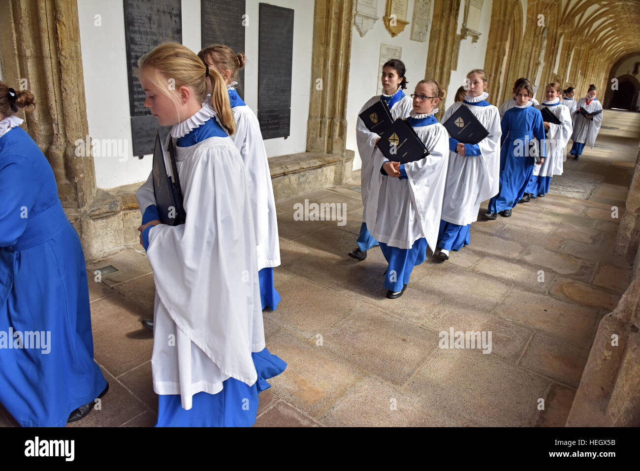 Girl choristers from Wells Cathedral Choir rehearse for evensong chorister duty in the quire at Wells Cathedral. Stock Photo