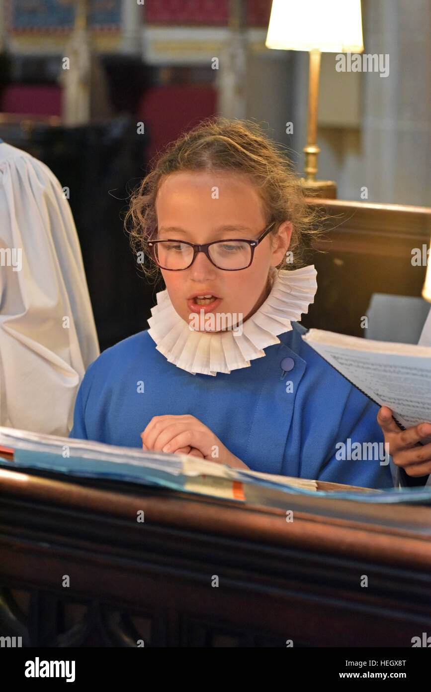 Girl choristers from Wells Cathedral Choir rehearse for evensong chorister duty in the quire at Wells Cathedral. Stock Photo